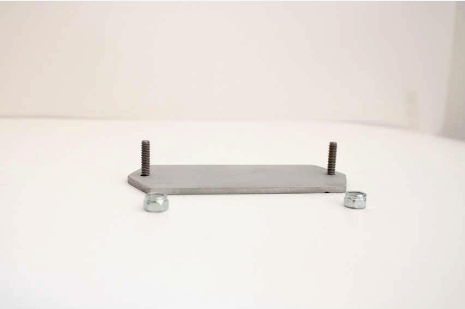 Regulator mounting plate kit (VREG20) with nylok nuts all on a white table.